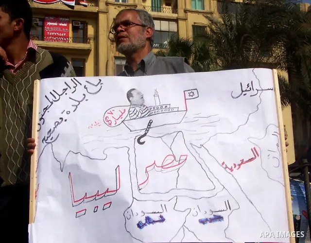 Anti-government protesters gather in front the state television building in Cairo, Egypt, Friday, Feb. 11, 2011. Mubarak has refused to step down or leave the country, and instead handed his administrative powers to his...