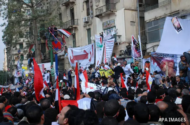 Anti-government protesters demonstrate after traditional Muslim Friday prayers at the continuing demonstration in Tahrir Square in downtown Cairo, Egypt, Friday, Feb. 11, 2011. Photo by Ahmed Asad