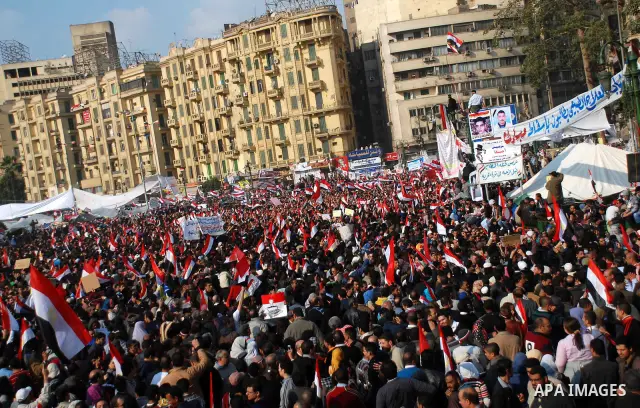 Anti-government protesters demonstrate after traditional Muslim Friday prayers at the continuing demonstration in Tahrir Square in downtown Cairo, Egypt, Friday, Feb. 11, 2011. Photo by Ahmed Asad