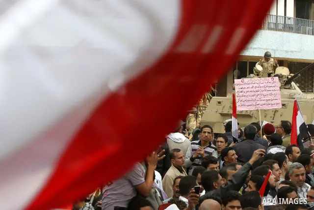Anti-government protesters gather in front the state television building in Cairo, Egypt, Friday, Feb. 11, 2011. Mubarak has refused to step down or leave the country, and instead handed his administrative powers to his...