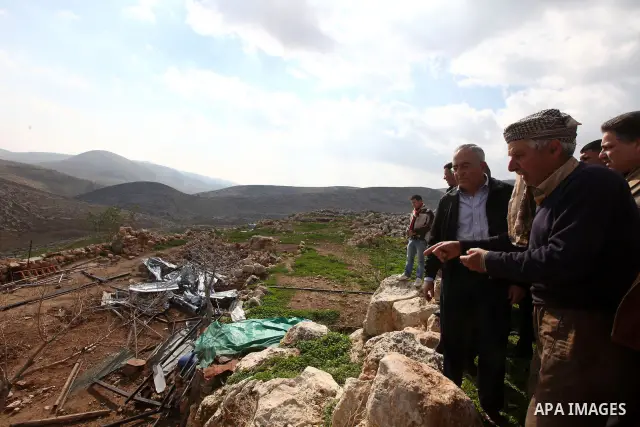 Palestinian Prime Minister Salam Fayyad visits the houses which were destroyed by Israeli army in the village of Khirbet Tana near the West Bank city of Nablus, Feb. 11, 2011. Photo by Mustafa Abu Dayeh