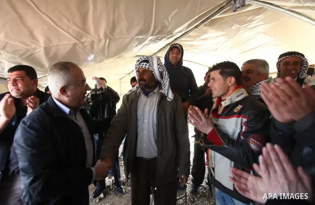 Palestinian Prime Minister Salam Fayyad visits the houses which were destroyed by Israeli army in the village of Khirbet Tana near the West Bank city of Nablus, Feb. 11, 2011. Photo by Mustafa Abu Dayeh