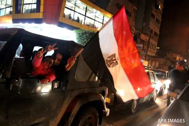 Palestinians celebrate the news of the resignation of President Hosni Mubarak, who handed control of the country to the military, at night in Gaza city, Friday, Feb. 11, 2011 Photo by Naaman Omar