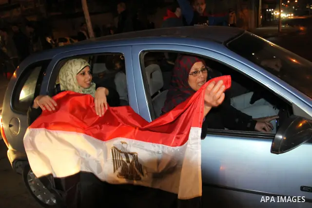 Palestinians celebrate the news of the resignation of President Hosni Mubarak, who handed control of the country to the military, at night in Gaza city, Friday, Feb. 11, 2011 Photo by Naaman Omar