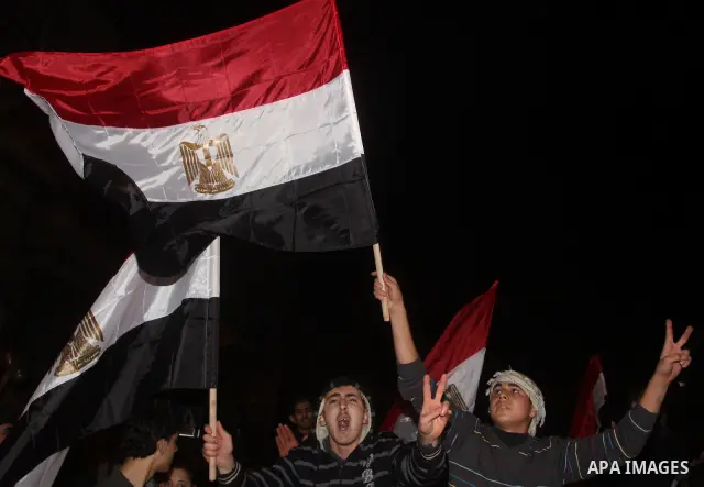Palestinians celebrate the news of the resignation of President Hosni Mubarak, who handed control of the country to the military, at night in Gaza city, Friday, Feb. 11, 2011 Photo by Mohamed Asad