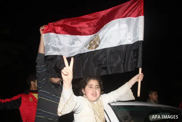 Palestinians celebrate the news of the resignation of President Hosni Mubarak, who handed control of the country to the military, at night in Gaza city, Friday, Feb. 11, 2011 Photo by Mohamed Asad