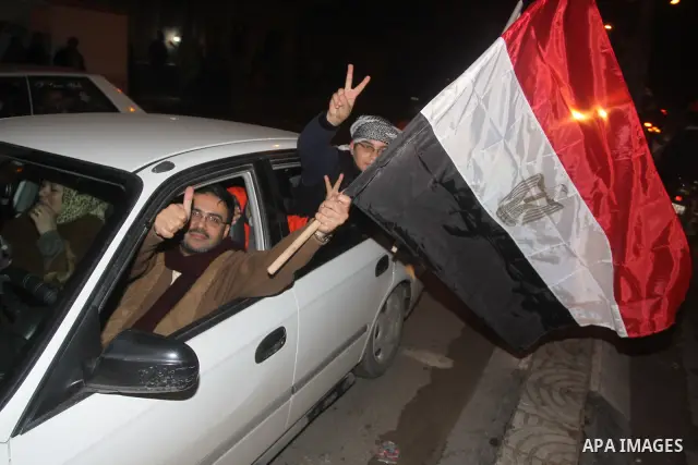 Palestinians celebrate the news of the resignation of President Hosni Mubarak, who handed control of the country to the military, at night in Gaza city, Friday, Feb. 11, 2011 Photo by Mohamed Asad