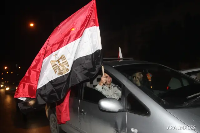 Palestinians celebrate the news of the resignation of President Hosni Mubarak, who handed control of the country to the military, at night in Gaza city, Friday, Feb. 11, 2011 Photo by Mohamed Asad