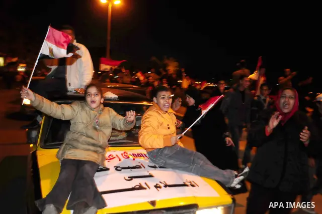 Egyptians celebrate the resignation of President Hosni Mubarak in Alexandria, Egypt, Feb. 11, 2011. Egypt's President Hosni Mubarak steps down and the military take charge of the country, Egypt's Vice President Omar Sule...