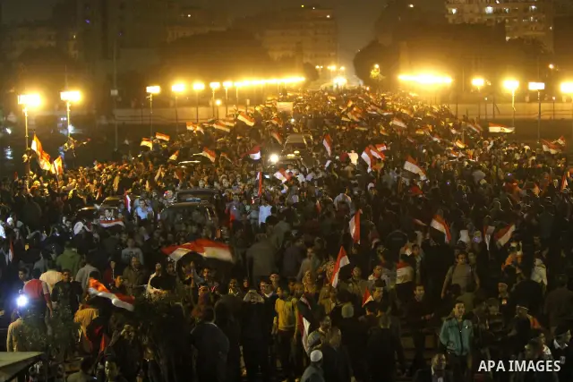Egyptians celebrate the news of the resignation of President Hosni Mubarak, who handed control of the country to the military, at night in Tahrir Square in downtown Cairo, Egypt Friday, Feb. 11, 2011. Photo by Karam Nass...