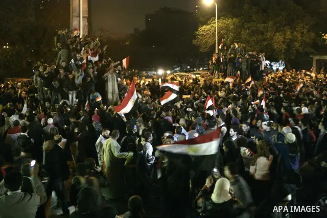 Egyptians celebrate the news of the resignation of President Hosni Mubarak, who handed control of the country to the military, at night in Tahrir Square in downtown Cairo, Egypt Friday, Feb. 11, 2011. Photo by Karam Nass...
