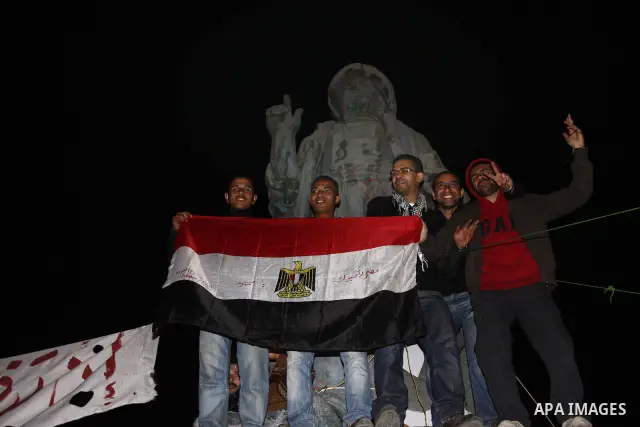 Egyptians celebrate the news of the resignation of President Hosni Mubarak, who handed control of the country to the military, at night in Tahrir Square in downtown Cairo, Egypt Friday, Feb. 11, 2011. Photo by Ahmed Asad
