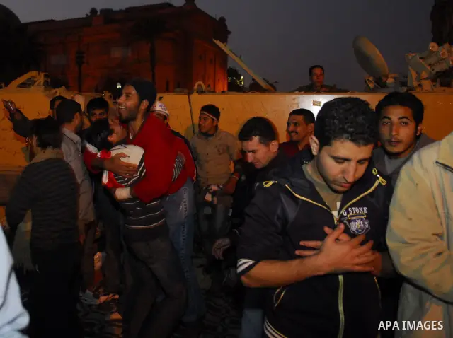 Egyptians celebrate the news of the resignation of President Hosni Mubarak, who handed control of the country to the military, at night in Tahrir Square in downtown Cairo, Egypt Friday, Feb. 11, 2011. Photo by Ahmed Asad