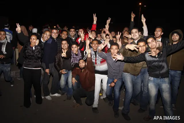 Egyptians celebrate the news of the resignation of President Hosni Mubarak, who handed control of the country to the military, at night in Tahrir Square in downtown Cairo, Egypt Friday, Feb. 11, 2011. Photo by Ahmed Asad