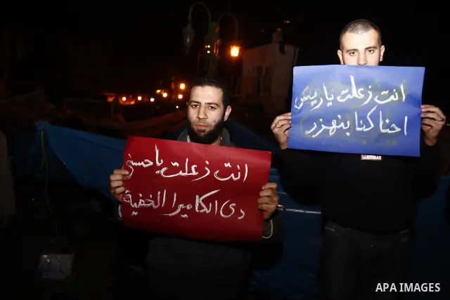 Egyptians celebrate the news of the resignation of President Hosni Mubarak, who handed control of the country to the military, at night in Tahrir Square in downtown Cairo, Egypt Friday, Feb. 11, 2011. Photo by Ahmed Asad