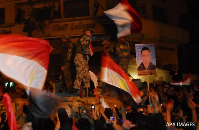 Egyptians celebrate the news of the resignation of President Hosni Mubarak, who handed control of the country to the military, at night in Tahrir Square in downtown Cairo, Egypt Friday, Feb. 11, 2011. Photo by Ahmed Asad