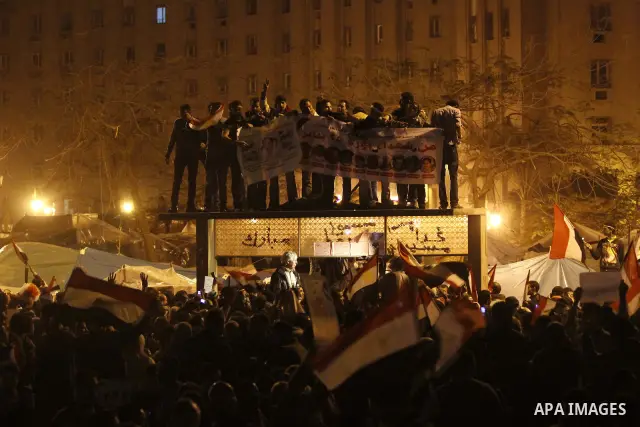 Egyptians celebrate the news of the resignation of President Hosni Mubarak, who handed control of the country to the military, at night in Tahrir Square in downtown Cairo, Egypt Friday, Feb. 11, 2011. Photo by Karam Nass...