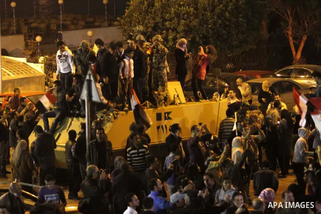 Egyptians celebrate the news of the resignation of President Hosni Mubarak, who handed control of the country to the military, at night in Tahrir Square in downtown Cairo, Egypt Friday, Feb. 11, 2011. Photo by Karam Nass...