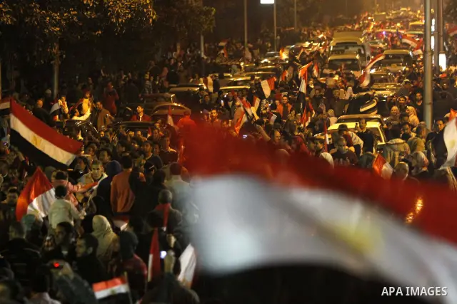 Egyptians celebrate the news of the resignation of President Hosni Mubarak, who handed control of the country to the military, at night in Tahrir Square in downtown Cairo, Egypt Friday, Feb. 11, 2011. Photo by Karam Nass...