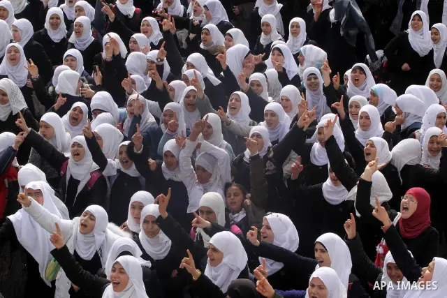 Palestinian students participate in a rally celebrating the resignation of Egyptian President Hosni Mubarak, in Gaza City, on Feb. 12, 2011. Photo by Mohammed Asad