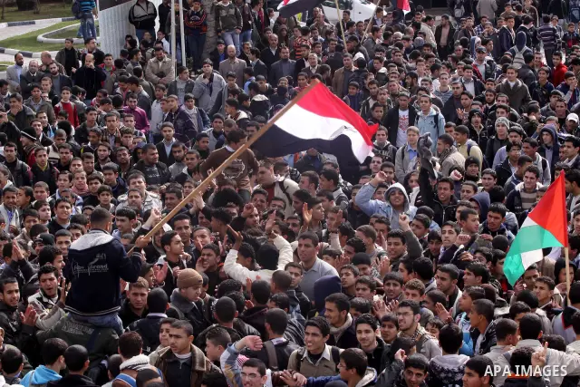 Palestinian students participate in a rally celebrating the resignation of Egyptian President Hosni Mubarak, in Gaza City, on Feb. 12, 2011. Photo by Mohammed Asad