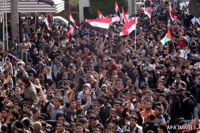 Palestinian students participate in a rally celebrating the resignation of Egyptian President Hosni Mubarak, in Gaza City, on Feb. 12, 2011. Photo by Mohammed Asad