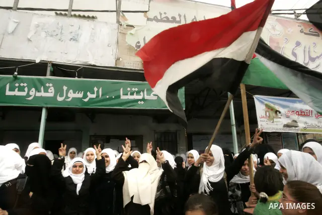 Palestinian students participate in a rally celebrating the resignation of Egyptian President Hosni Mubarak, in southern Gaza Strip town of Rafah on Feb. 12, 2011. Photo by Abed Rahim Khatib