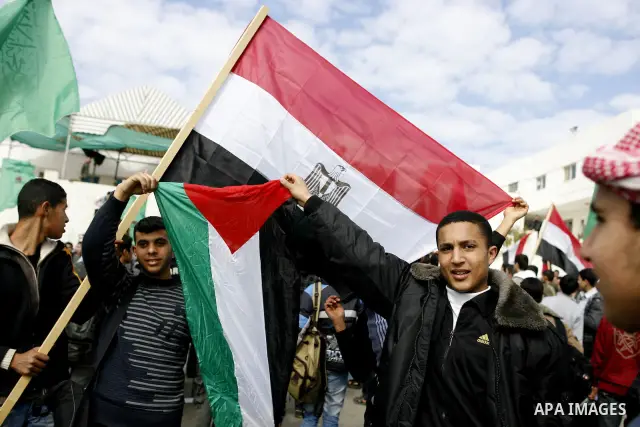 Palestinians celebrate Egyptian President Hosni Mubarak's resignation, in Gaza City, Saturday, Feb. 12 , 2011. Hamas leaders called on the new Egypt to open the borders with Gaza. "Egypt wrote today a new chapter in the...