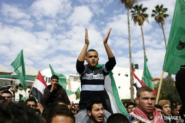 Palestinians celebrate Egyptian President Hosni Mubarak's resignation, in Gaza City, Saturday, Feb. 12 , 2011. Hamas leaders called on the new Egypt to open the borders with Gaza. "Egypt wrote today a new chapter in the...