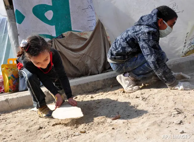 Egyptians clean up garbage and rocks from a street near Tahrir Square in downtown Cairo, Egypt, Saturday, Feb. 12, 2011. Egyptian protesters were jubilant Saturday over their success in ousting former President Hosni Mub...