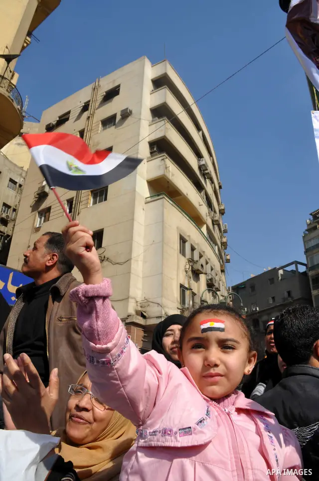 Egyptians celebrate and wave national flags in Tahrir Square in Cairo, Egypt, Saturday, Feb. 12, 2011. Egypt exploded with joy, tears, and relief after pro-democracy protesters brought down President Hosni Mubarak with a...