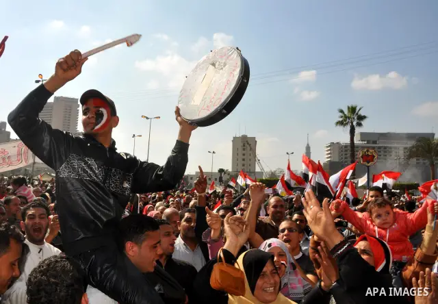 Egyptians celebrate and wave national flags in Tahrir Square in Cairo, Egypt, Saturday, Feb. 12, 2011. Egypt exploded with joy, tears, and relief after pro-democracy protesters brought down President Hosni Mubarak with a...