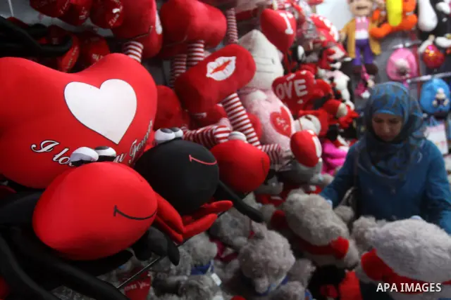 A Palestinian girl buys a gift for Valentine's Day at a shop in Gaza City on February 13, 2010. Valentine's Day marks a Christian holiday on Feb, 14. Photo by Mohammed Asad