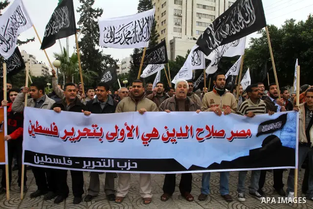 Palestinian supporters of the Al-Tahrir Islamic party shout slogans in support of the protesters in Egypt who forced their President Hosni Mubarak to resign, as they march in a rally in Gaza City on February 13, 2011. Ph...