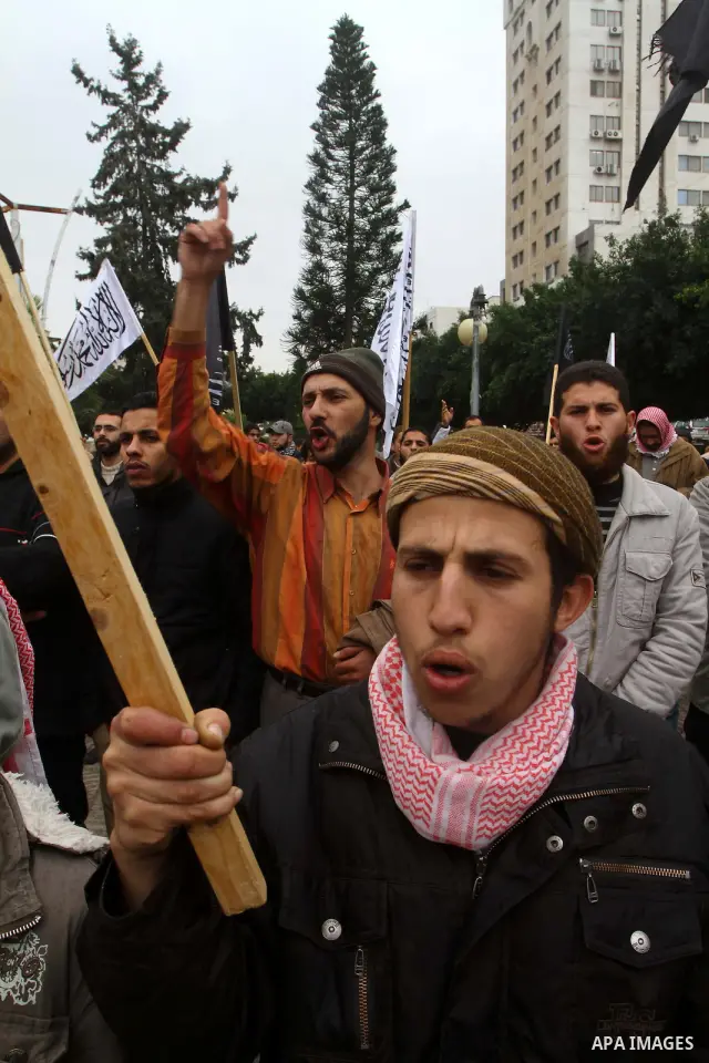 Palestinian supporters of the Al-Tahrir Islamic party shout slogans in support of the protesters in Egypt who forced their President Hosni Mubarak to resign, as they march in a rally in Gaza City on February 13, 2011. Ph...
