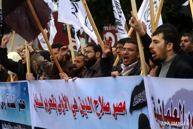 Palestinian supporters of the Al-Tahrir Islamic party shout slogans in support of the protesters in Egypt who forced their President Hosni Mubarak to resign, as they march in a rally in Gaza City on February 13, 2011. Ph...