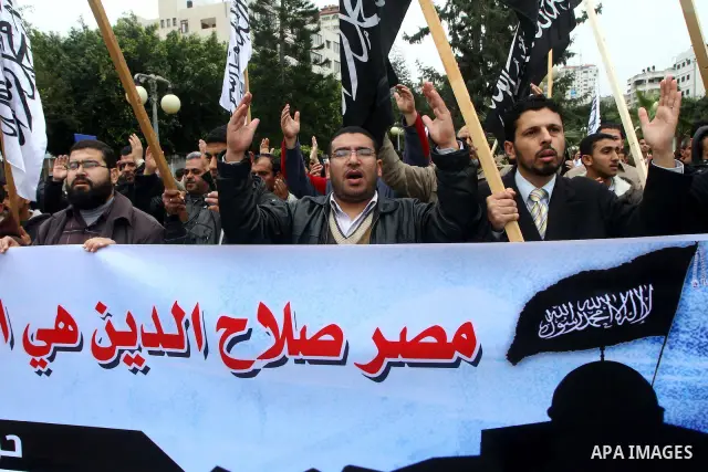 Palestinian supporters of the Al-Tahrir Islamic party shout slogans in support of the protesters in Egypt who forced their President Hosni Mubarak to resign, as they march in a rally in Gaza City on February 13, 2011. Ph...