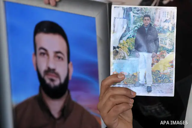 Palestinian women hold pictures of jailed relatives during a protest calling for the release of Palestinian prisoners from Israeli jails at the Red Cross office in Gaza City on Feb. 14,2011. Photo by Mohammed Asad