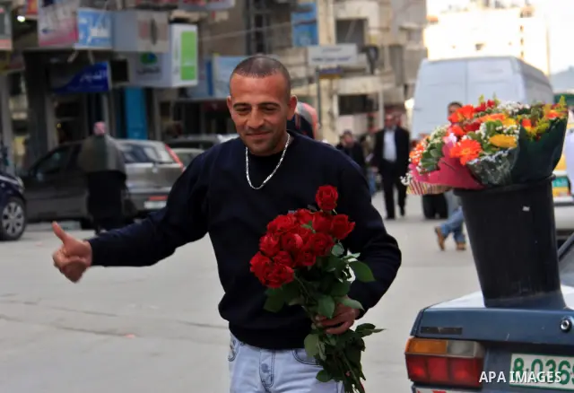 A Palestinian man sells flowers in the Valentine's Day in the West Bank city of Nablus February 14, 2011. Photo by Wagdi Eshtayah
