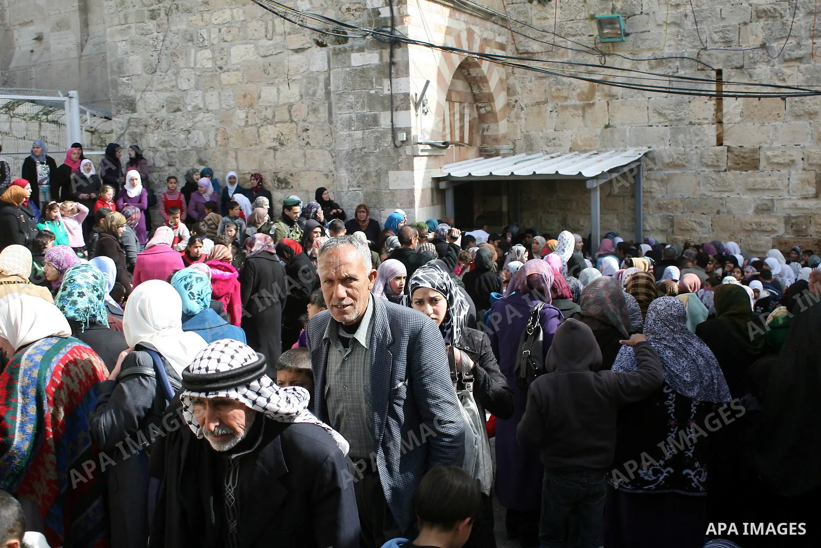 Palestinians go to Ibrahimi mosque as they march in a procession to mark the birth anniversary of Islam's prophet Mohammed, in the West Bank city of Hebron Tuesday, Feb. 15, 2011. Muslims celebrate Prophet Mohammed's bir...