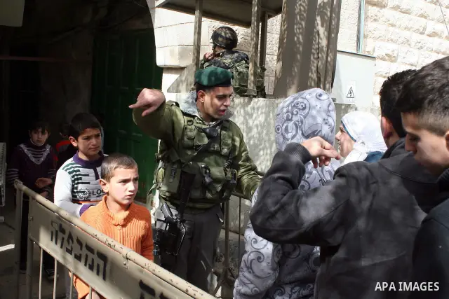 Palestinians go to Ibrahimi mosque as they march in a procession to mark the birth anniversary of Islam's prophet Mohammed, in the West Bank city of Hebron Tuesday, Feb. 15, 2011. Muslims celebrate Prophet Mohammed's bir...