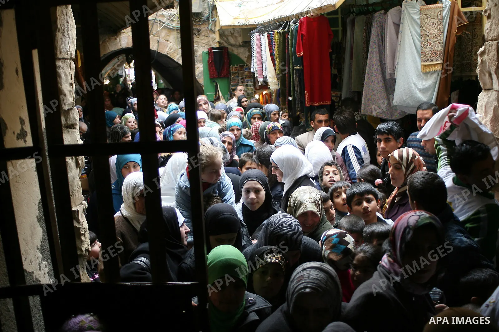 Palestinians go to Ibrahimi mosque as they march in a procession to mark the birth anniversary of Islam's prophet Mohammed, in the West Bank city of Hebron Tuesday, Feb. 15, 2011. Muslims celebrate Prophet Mohammed's bir...