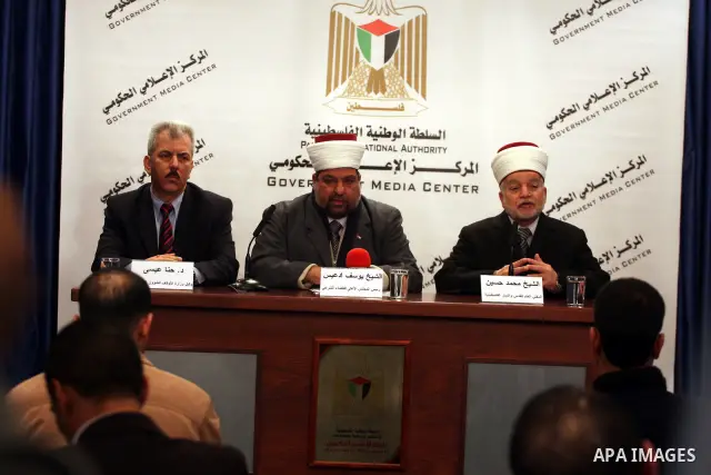 Yousuf Adaies, the head of the Supreme Council of the legitimate judical, Mohammed Hussein, the mufti of Jerusalem and Palestine and Hanna Issa, the Minister of the Endowments for Christian affairs attends a joint news c...
