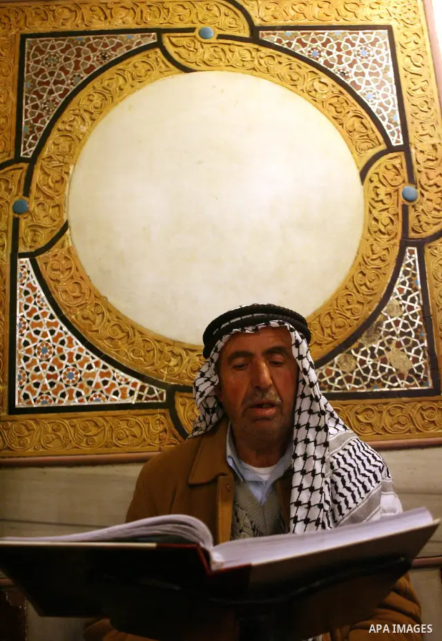 Palestinians take part in Ibrahimi mosque as they march in a procession to mark the birth anniversary of Islam's prophet Mohammed, in the West Bank city of Hebron Tuesday, Feb. 16, 2011. Muslims celebrate Prophet Mohamme...