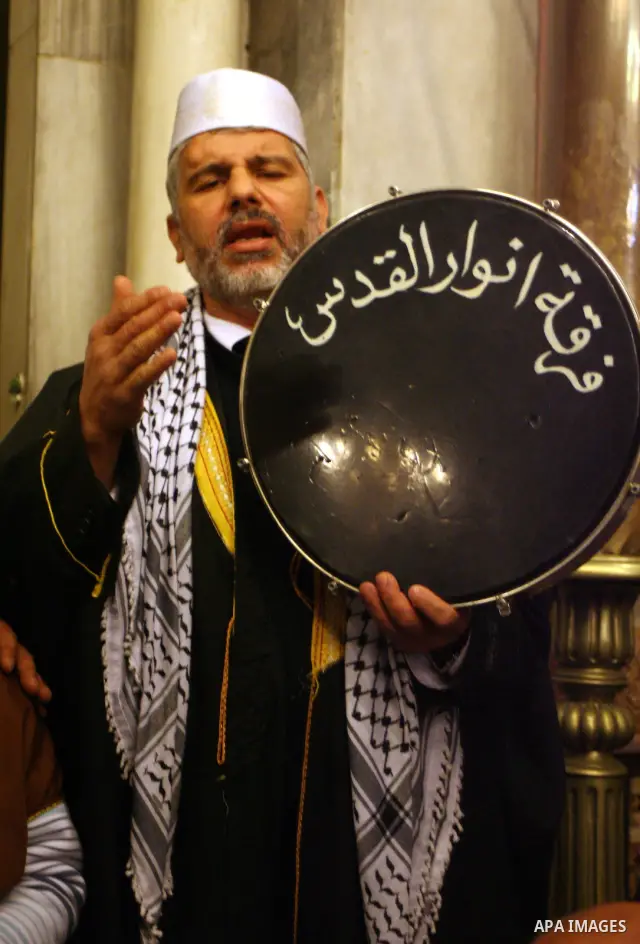 Palestinians take part in Ibrahimi mosque as they march in a procession to mark the birth anniversary of Islam's prophet Mohammed, in the West Bank city of Hebron Tuesday, Feb. 16, 2011. Muslims celebrate Prophet Mohamme...