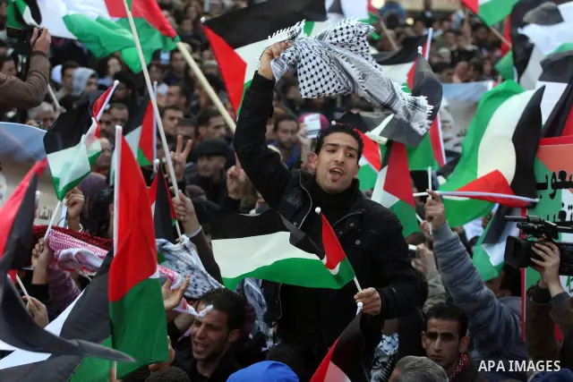 Palestinians take part in a rally calling for ending the Palestinian division, in the West Bank city of Ramallah on Feb. 17, 2011. More than 3000 protesters call for free elections and the reconciliation between the two...