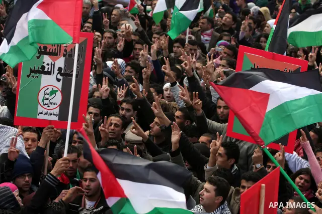 Palestinians take part in a rally calling for ending the Palestinian division, in the West Bank city of Ramallah on Feb. 17, 2011. More than 3000 protesters call for free elections and the reconciliation between the two...