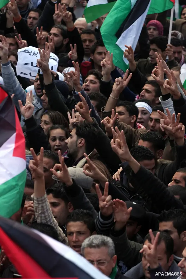 Palestinians take part in a rally calling for ending the Palestinian division, in the West Bank city of Ramallah on Feb. 17, 2011. More than 3000 protesters call for free elections and the reconciliation between the two...