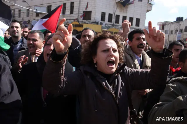 Palestinians take part in a rally calling for ending the Palestinian division, in the West Bank city of Ramallah on Feb. 17, 2011. More than 3000 protesters call for free elections and the reconciliation between the two...