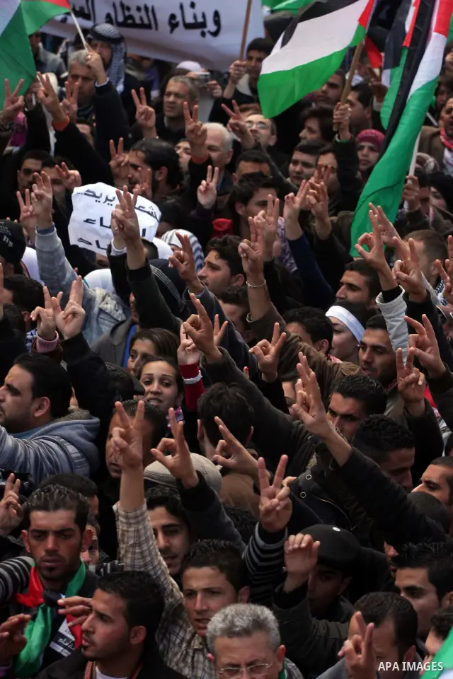 Palestinians take part in a rally calling for ending the Palestinian division, in the West Bank city of Ramallah on Feb. 17, 2011. More than 3000 protesters call for free elections and the reconciliation between the two...
